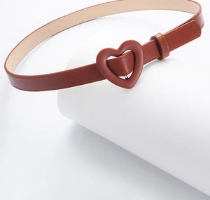 Detailed view of children's brown PU leather belt with heart-shaped buckle on display