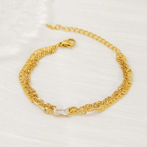 Gold layered bracelet with geometric H-link chain and rectangular cubic zirconia stone