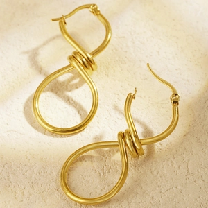 Polished 18K gold plated spiral knot earrings for women in a minimalist wire wrap style