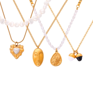 Minimalist gold plated titanium necklaces featuring fresh water pearls and geometric pendants