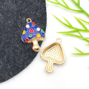 Macro shot of colorful oil-dripped mushroom alloy charms for DIY jewelry making