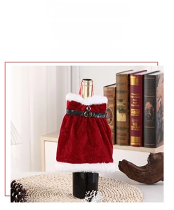 Detailed view of plush red velvet Christmas wine bottle cover with faux fur and belt