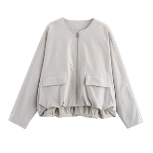 Detail of light beige flight jacket with metal zipper and elastic drawstring hemline
