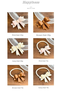 Detail of acetate double-layered bow hair clips and ties in pink, coffee and cream tones