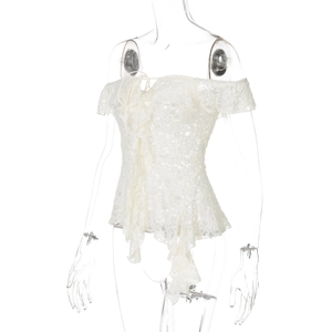 Close-up of white lace off-shoulder top with corset-style lacing and irregular hem detail