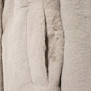 Beige faux fur long coat with soft texture and side pocket detail for winter warm