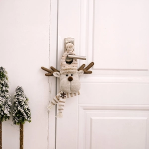 Detail of plush reindeer Christmas door hanger with scarf and hat on white handle