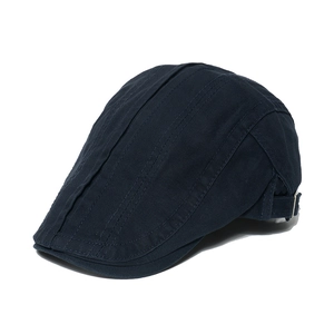 Detailed view of navy blue cotton ivy cap with metal adjustment buckle and top stitching