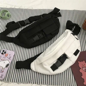 Japanese style canvas chest bag in black and white with multi-pocket design for women