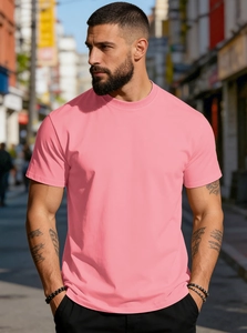 Detail of pink cotton T-shirt showing relaxed fit and premium texture on male model