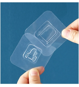 Close-up of transparent adhesive wall mount sticker with secure snap-on bracket