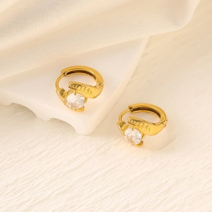 Close-up of gold stainless steel hoop earrings with clear round zirconia stones
