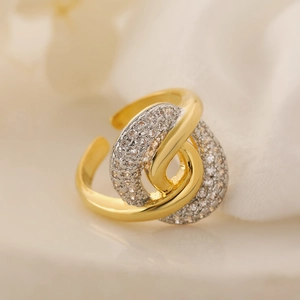 Two-tone gold plated geometric open ring with cubic zirconia in a wrap design