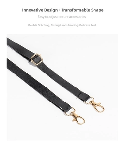 Detail of adjustable black leather strap with gold buckles and reinforced double stitching