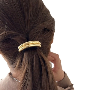 Sleek gold double-ring metal ponytail holder minimalist hair tie accessory for women