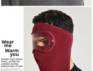 Detail of burgundy polar fleece winter face mask with goggles and breathing vents
