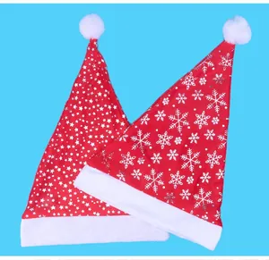 Detailed view of two Christmas hats featuring classic snowflake and star pattern designs