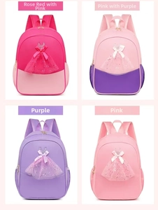 Detail view of four ballet backpacks in pink, purple, and rose with 3D sequin tutus