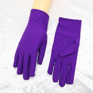 Close-up of purple spandex etiquette gloves with elastic fabric texture and smooth finish