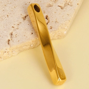 Macro shot of 304 stainless steel twisted gold bar pendant with polished smooth finish