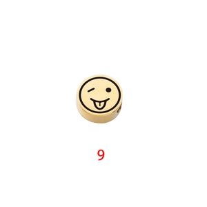 Detailed view of a gold stainless steel round bead with a wink emoji laser engraving