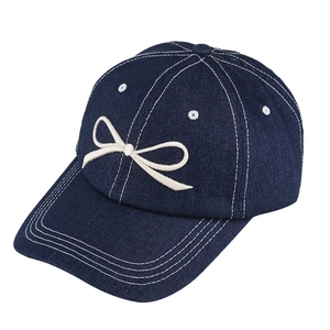 Dark blue denim baseball cap featuring white bow embroidery and adjustable back strap