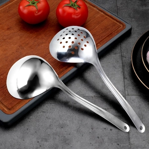 Set of 304 stainless steel soup ladle and colander on dark countertop with wood board