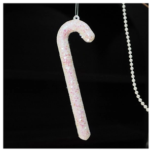 Close-up of glittery white candy cane Christmas ornament with pink iridescent sequins