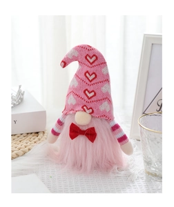 Gnomo di peluche rosa per San Valentino con cappello a cuori e papillon rosso su pizzo