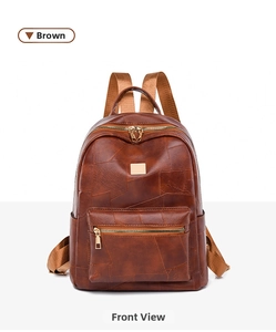 Detailed front view of brown textured patchwork backpack with gold zippers