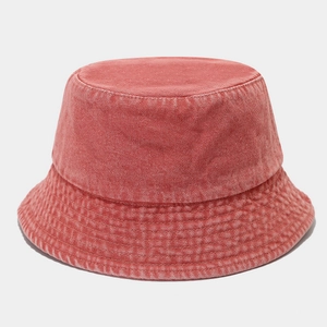 Detail of vintage washed cotton bucket hat showing parallel reinforced stitching on the brim