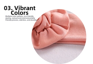 Detail view of pink ribbed elastic fabric showing soft texture and fine vertical stripes