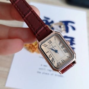 Vintage rectangular quartz watch with rose gold case and burgundy leather strap