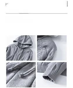 Detail of grey cable knit hoodie showing thick drawstrings and ribbed cuffs on sleeve