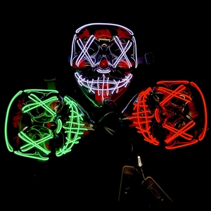 Three glowing LED Halloween masks with blue green and red EL wire in a dark setting