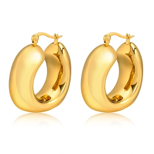 Polished thick gold chunky hoop earrings with leverback closure on white background
