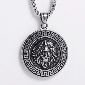 Detailed close-up of a silver lion head pendant with Greek key pattern on a chain