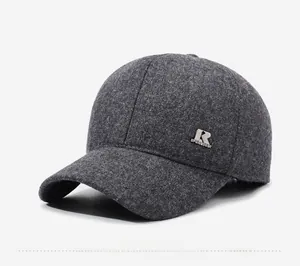 Detail shot of a dark grey wool baseball cap showing the R logo and premium thick fabric