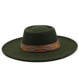 Detail of dark green wool fedora with brown leather band and silver rivet accents