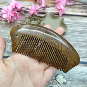 Handcrafted 13cm dark sandalwood hair comb with natural wood grain in crescent shape