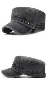 Detail of washed cotton cadet hat in dark grey with vintage texture and metal logo plate
