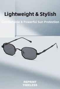Detail of slim black metal frame with polygonal dark grey lenses and clear nose pads