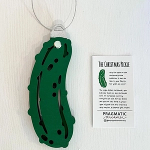 Christmas Pickle Ornament with hanging cord and tradition card on white background