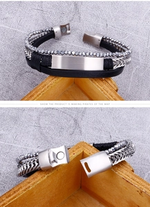 Detail showing multi-layer leather bracelet with metal plate and magnetic clasp