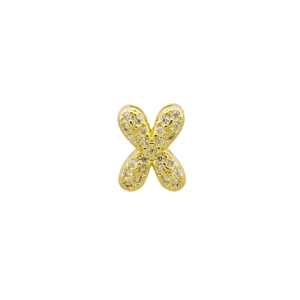 Macro shot of gold-plated letter X pendant fully paved with sparkling cubic zirconia