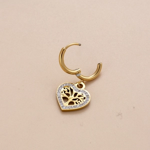 Golden heart earrings featuring a tree of life design and sparkling crystal pavé