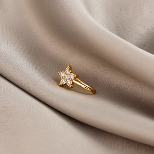 Gold star non-pierced U-shaped nose clip with shimmering cubic zirconia on silk