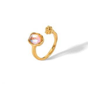 Detail of 18K gold stainless steel open ring with opal stone and small floral accents