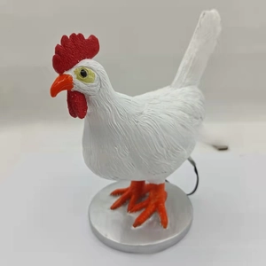 Macro detail of realistic chicken night light with USB power cable and metal base
