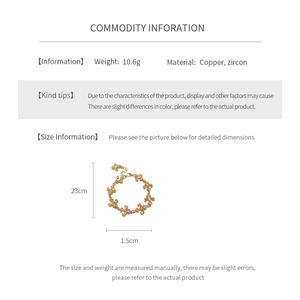 Détails d'un bracelet fleur doré en cuivre et zircon avec les spécifications